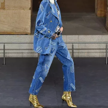 Chanel Crocodile Embossed Metallic Calfskin Gold Ankle Boots worn by Kaia Jordan Gerber on her Instagram account @kaiagerber