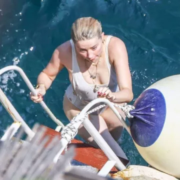 Thapelo Paris Karlie Button Detail Scoop Side Swimsuit worn by Amber Heard the Amalfi Coast July 27, 2019