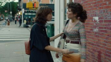 The backpack in brown worn by Rachel (Hannah Pearl Utt) in Before You Know It