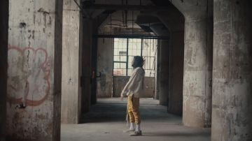 The pants yellow worn by J Cole's in the clip Sacrifices of Dreamville feat. EARTHGANG