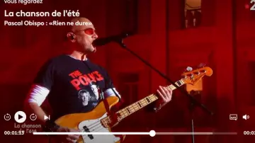 The tee shirt is black The Police of Pascal Obispo in The Song of the summer of the 21.08.2019