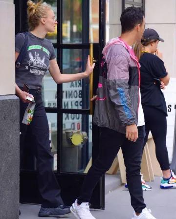 Naked Wolfe Strack Black Leather And Suede Sneakers worn by Sophia Turner New York City August 27, 2019