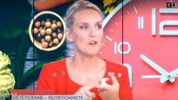 The red dress with golden buttons on the shoulders of Sandra Ferreira in William at noon the 02.09.2019