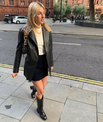 Black leather high boots worn by Camille Charriere on @camillecharriere