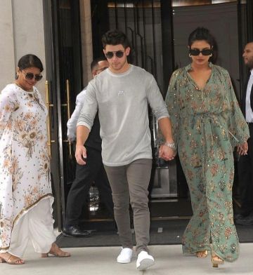 Vans white sneakers worn by Nick Jonas New York City September 5, 2019