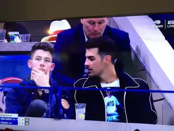 Sandro Bomber jacket in navy worn by  Joe Jonas Us Open September 6, 2019