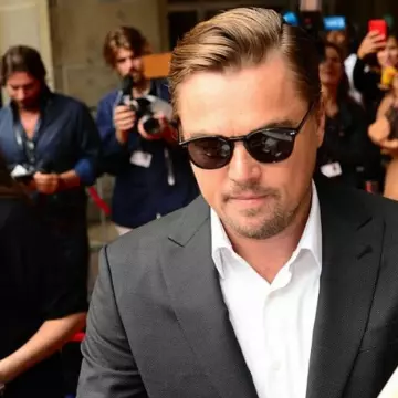 Garrett Leight beach sun in black-gold with G15 Lenses worn by Leonardo Dicaprio Toronto Film Festival September 8, 2019