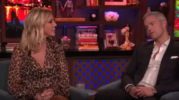 Caroline Constas Bette leopard print twist front blouson sleeve top worn by Andy Cohen on Watch What Happens Live with Andy Cohen SEPTEMBER 11, 2019