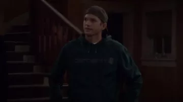 Carharrt Green Delmont Signature Graphic Hooded Sweatshirt worn by Colt Bennett (Ashton Kutcher) in The Ranch Season 4 Episode 3