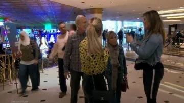 Chanel black quilted chanel fold over bag worn by (Braunwyn Windham) in The Real Housewives of Orange County Season14 Episode 7