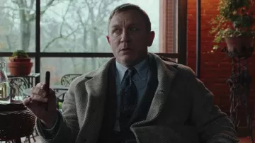 Brooks Brothers Tan Herringbone topcoat worn by Benoit Blanc (Daniel Craig) in Knives Out