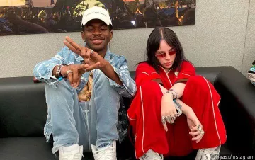 Red Slim Sunglasses worn by Billie Eilish on Lil Nas X Instagram picture