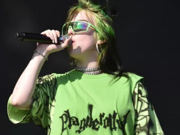 Prada Eyewear sunglasses in lime yellow worn by Billie Eilish for her live performance