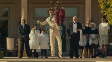 The suit trousers beige worn by an extra in the movie clip Liar of Camila Cabello