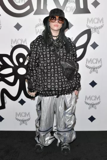 The pants parachute MCM Worldwide worn by Billie Eilish at the opening of the MCM Global Flagship Store on Rodeo Drive in Los Angeles in march 2019