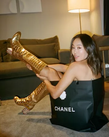 Chanel gold crocodile boots of Aimee Song on the Instagram account @aimeesong