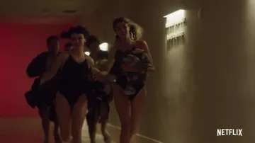 Black one piece swimsuit worn by Ludovica (Alice Pagani) in Baby (S02)