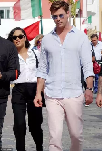 Pink trousers worn by Chris Hemsworth on the set of Men in Black: International