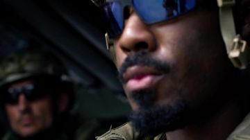 Tactical sunglasses worn by (Remi Adeleke) in 6 Underground