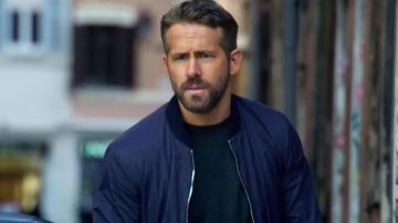 Blue bomber jacket worn by One (Ryan Reynolds) in 6 Underground