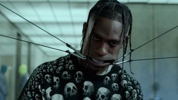 The sweater with skulls Liquid Blue worn by Travis Scott in her video clip HIGHEST IN THE ROOM