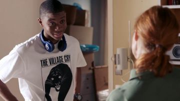 The t-shirt "the village cry" worn by Souleymane Myriel (Dembo Camilo) in Tomorrow belongs to us