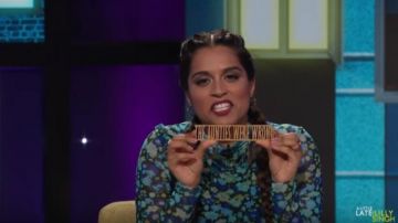 Ganni Mesh Floral turtleneck top worn by Lilly Singh as seen on A Little Late with Lilly Singh October 11, 2019