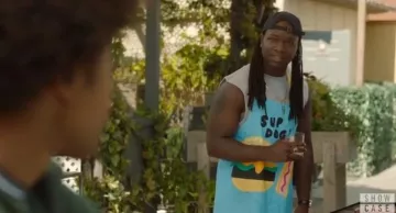 Sun squad blue sup dog apron worn by Kaleb (Chris Lee) in Legacies Season 2 Episode 1