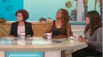 Vince palm leaf scoop-neck satin tank worn by Eve on The Talk October 15, 2019