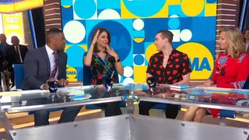 Nanette Black Flo­ral Wrap Top worn by Cecilia Vega on Good Morning America October 15, 2019