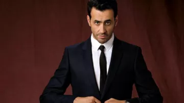 The suit jacket black worn by Marc (Jonathan Cohen) in The Flame Season 1