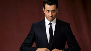 The suit jacket black worn by Marc (Jonathan Cohen) in The Flame Season 1