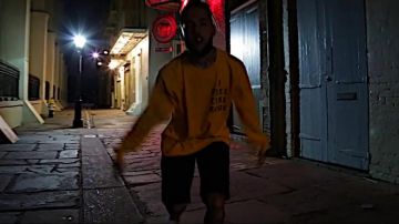The sweater yellow Scott Arceneaux in the clip "Magazine" of $uicideBoy$