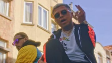 The tracksuit top black with orange strips worn by Hamza in his clip HS feat. SCH