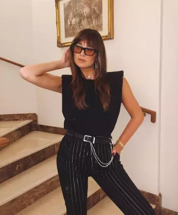 The black pants striped with Danielle Bernstein on her account Instagram @weworewhat