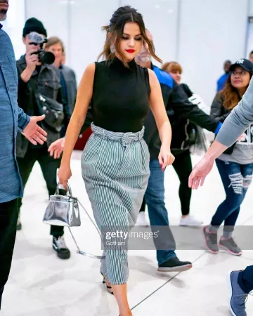 Miu Miu striped midi skirt worn by Selena Gomez Manhattan October 28, 2019