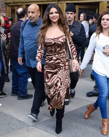 Celine medium triomphe bag in shiny calfskin worn by Selena Gomez Elvis Duran and the Z100 Morning Show October 28, 2019