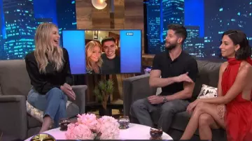Cinq à Sept silk pleat­ed turtle­neck top black worn by Morgan Stewart on E! News October 24, 2019