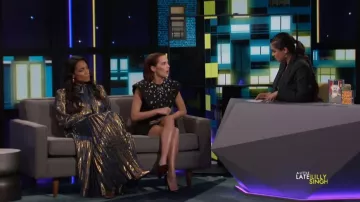 Metal­lic mi­di wrap dress worn by Lilly Singh on A Little Late with Lilly Singh October 24, 2019