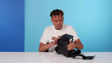 Louis vuitton Toiletry Bag worn by GQ in the  video 10