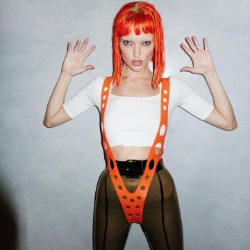 The shoulder straps plastic orange of Leeloo from the 5th element carried by Martha Hunt on the account Instagram of @marthahunt