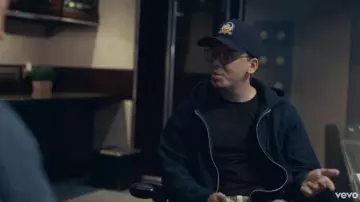 Merch Vi­sion­ary Ba­sic Hood­ie Black of Logic in the YouTube video Logic - Homicide ft. Eminem