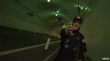 Alpha Industries Navy Bomber Flight Jack­et of Logic in the YouTube video Logic - Homicide ft. Eminem