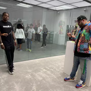 Needles Glit­ter Side Stripe Black Track­Pants of Pusha T on the Instagram account @kingpush