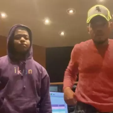 Polo Ralph Lauren Red Ca­ble Knit Crew­neck Sweater of Chance The Rapper on the Instagram account @chancetherapper