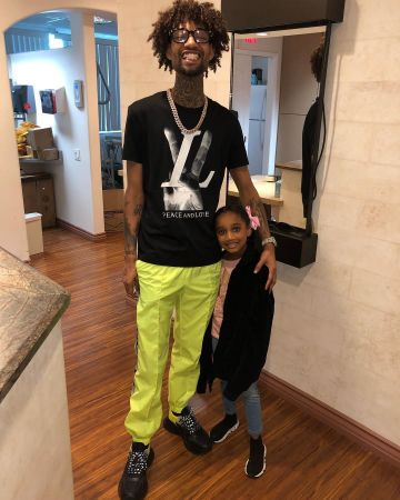 Off-white Lo­go Stripe Track Pants of PnB Rock on the Instagram account @pnbrock