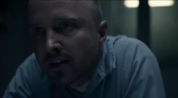 The blue shirt worn by Warren Cave Aaron Paul in the series Truth Be Told 