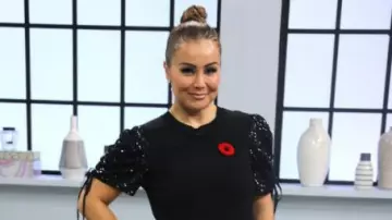 Parker Tash Se­quin Puff Sleeve Top worn by Melissa on The Loop November 11, 2019