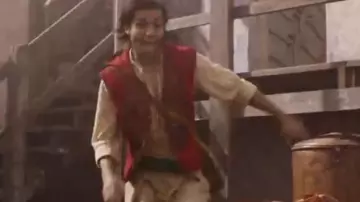 The replica of the costume from Aladdin of Aladdin (Mena Massoud) in Aladdin