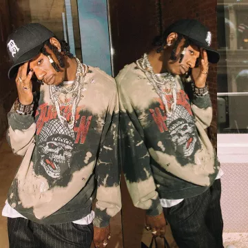 The sweatshirt two-tone Brown-Black graffiti worn by Joey Bada$$ on the account Instagram of @joeybadass 